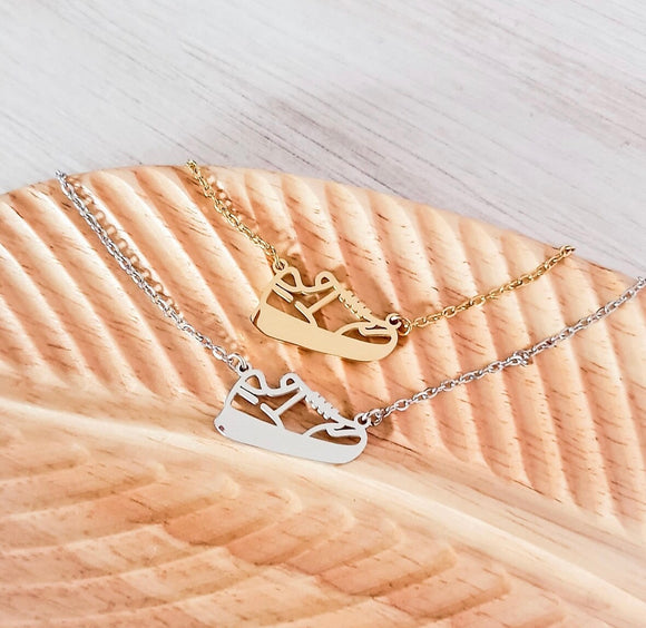 Engraved track shoe necklace